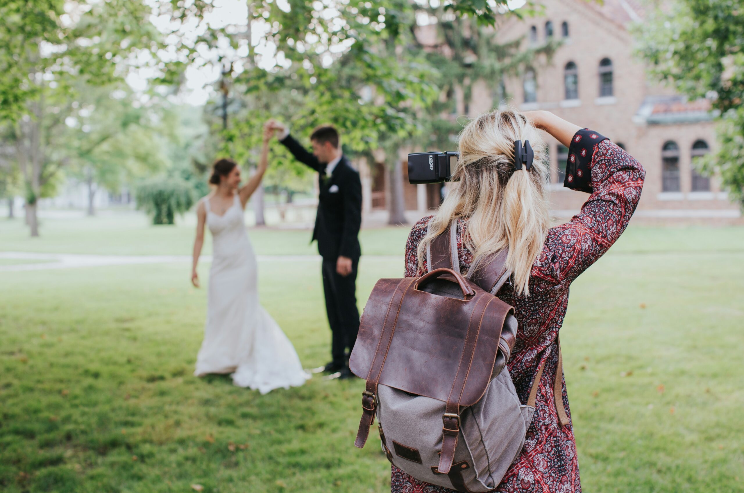 photographer taking a picture of a bride and groom