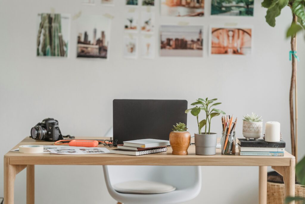 office with a laptop and camera on the desk.