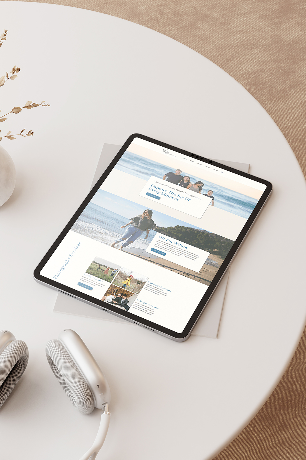 Picture of ipad on a table with a photography website on the screen.